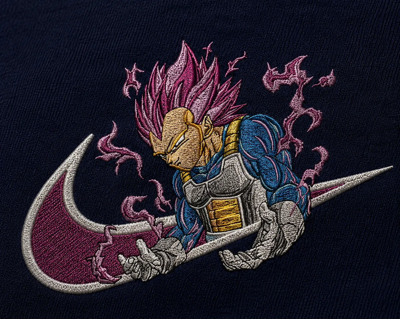 Model wearing a premium cotton T-shirt featuring high-quality embroidered Vegeta artwork inspired by Dragon Ball with detailed textured stitching.