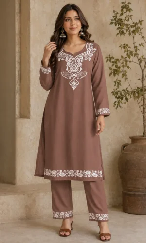 Women's straight kurta set featuring elegant white ornamental V-neck print with matching pants for ethnic and festive wear.